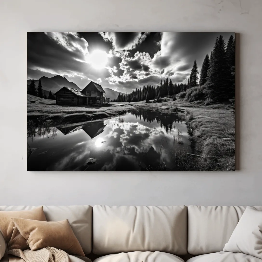 Black and white high contrast photograph of a cabin by the lake